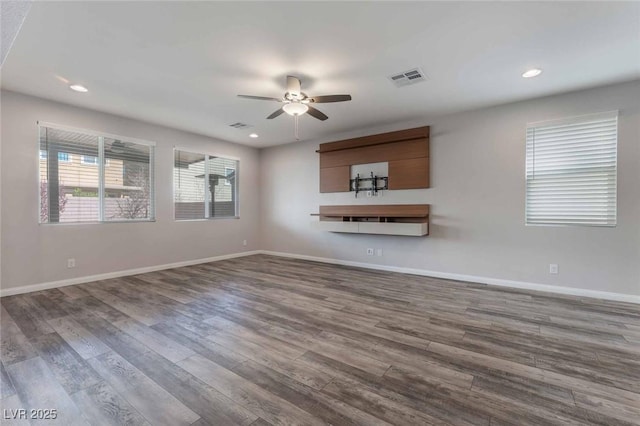9850 Poplar Point Ave, Las Vegas, NV 89178 - unfurnished living room featuring a ceiling fan, dark wood-style flooring, and recessed lighting