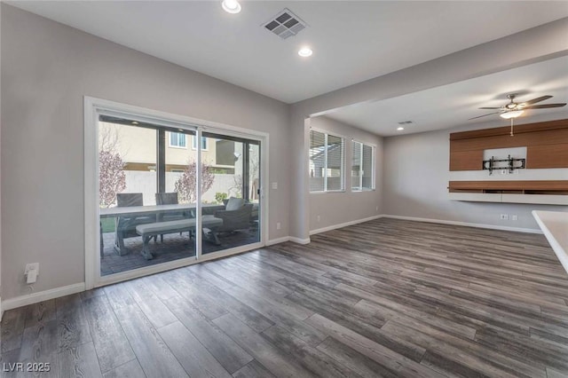 9850 Poplar Point Ave, Las Vegas, NV 89178 - unfurnished living room with dark wood-type flooring, plenty of natural light, recessed lighting, and a ceiling fan