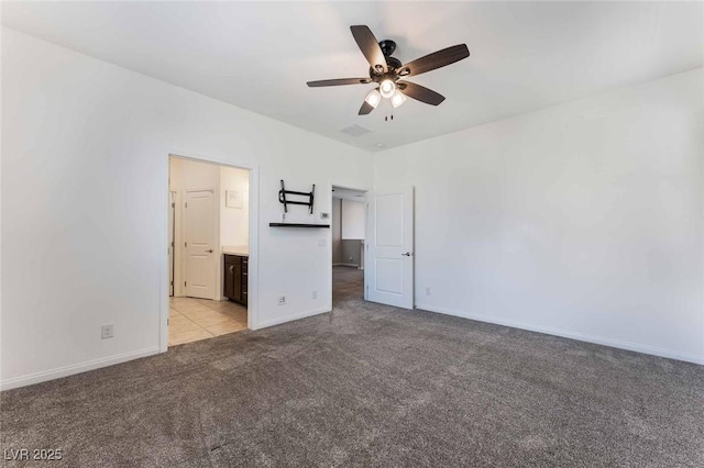 9850 Poplar Point Ave, Las Vegas, NV 89178 - unfurnished bedroom with light carpet, connected bathroom, and a ceiling fan