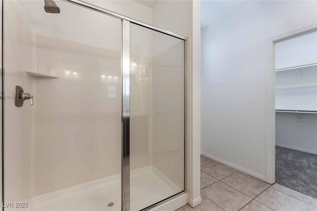 9850 Poplar Point Ave, Las Vegas, NV 89178 - full bath featuring a stall shower, tile patterned flooring, and a walk in closet