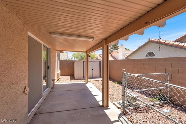 1613 Glenrosa Dr, North Las Vegas, NV 89031 - fenced backyard with a patio and a shed