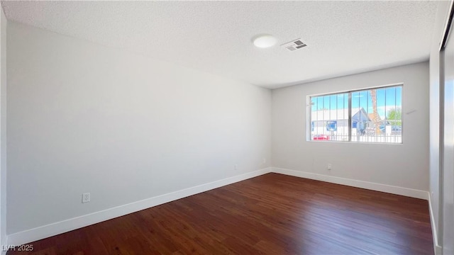 744 Hubbard St, Las Vegas, NV 89110 - unfurnished room featuring dark wood-style floors and a textured ceiling