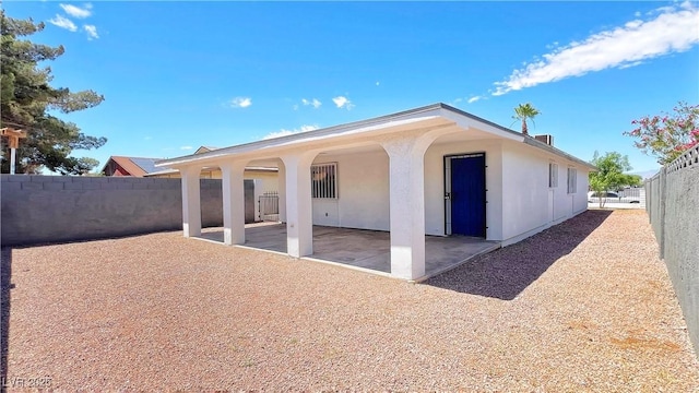 744 Hubbard St, Las Vegas, NV 89110 - back of property featuring a patio area and stucco siding