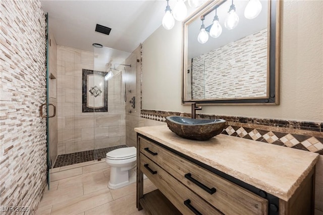 209 Camino Vista St, Henderson, NV 89012 - bathroom with a shower stall, vanity, tile patterned flooring, and tile walls