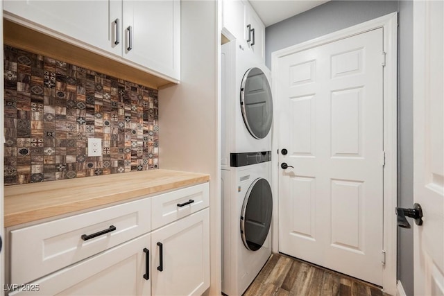 209 Camino Vista St, Henderson, NV 89012 - laundry area featuring stacked washer and clothes dryer, cabinet space, and dark wood finished floors