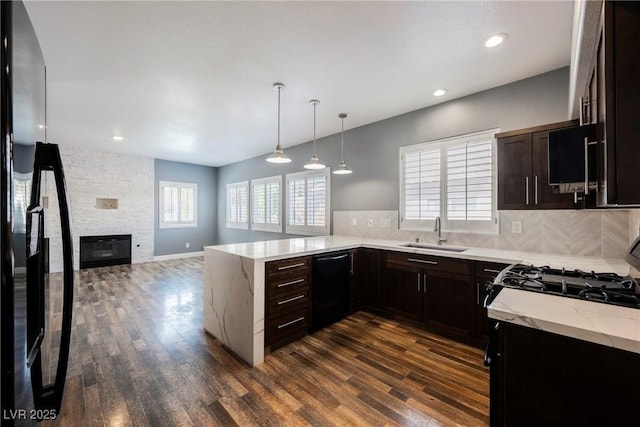 209 Camino Vista St, Henderson, NV 89012 - kitchen featuring black appliances, dark wood-type flooring, tasteful backsplash, light stone countertops, and recessed lighting