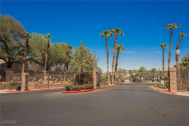 209 Camino Vista St, Henderson, NV 89012 - view of asphalt road with a gate, a gated entry, and curbs