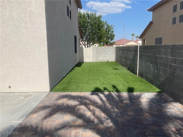 6043 Cape Clairmont Ct, North Las Vegas, NV 89031 - fenced backyard with a patio