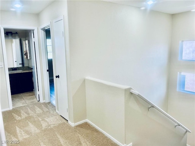 6043 Cape Clairmont Ct, North Las Vegas, NV 89031 - corridor with light colored carpet and baseboards