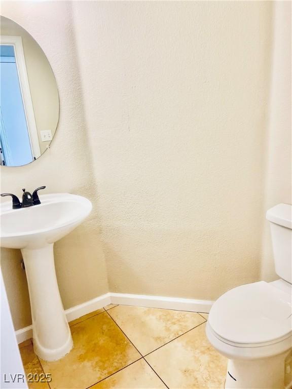 6043 Cape Clairmont Ct, North Las Vegas, NV 89031 - bathroom with baseboards and tile patterned floors