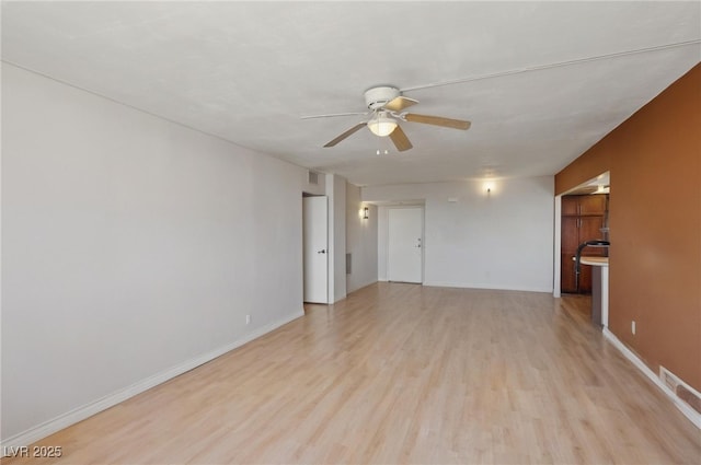 3930 University Center Dr Unit 804, Las Vegas, NV 89119 - unfurnished living room featuring a ceiling fan and light wood-type flooring