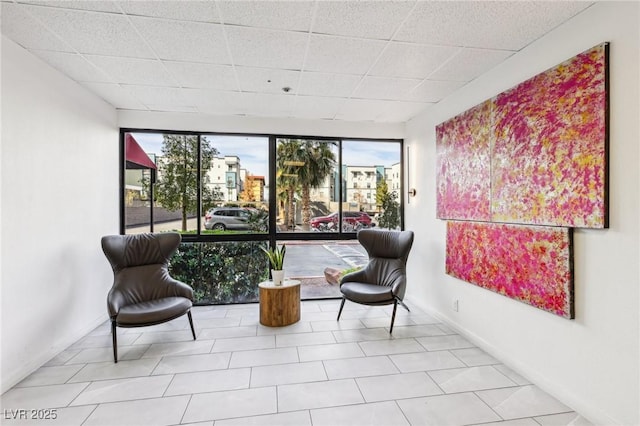 3930 University Center Dr Unit 804, Las Vegas, NV 89119 - living area featuring healthy amount of natural light and a paneled ceiling
