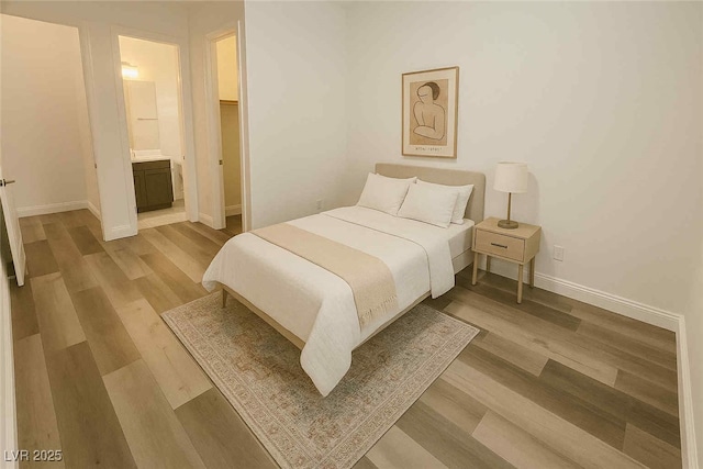 8550 Lost Pony St, Las Vegas, NV 89148 - bedroom with wood finished floors and ensuite bath