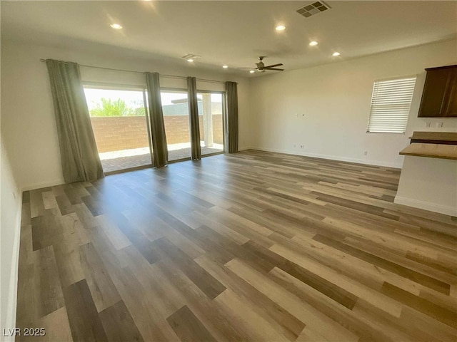 8550 Lost Pony St, Las Vegas, NV 89148 - unfurnished living room with recessed lighting, wood finished floors, and a ceiling fan