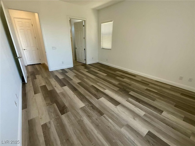 8550 Lost Pony St, Las Vegas, NV 89148 - unfurnished bedroom featuring wood finished floors and baseboards