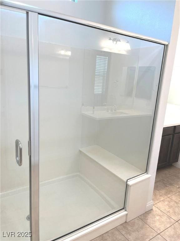 8550 Lost Pony St, Las Vegas, NV 89148 - full bathroom with tile patterned flooring, a shower stall, and vanity