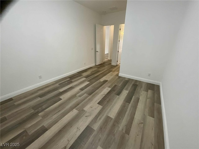 8550 Lost Pony St, Las Vegas, NV 89148 - empty room featuring baseboards and wood finished floors