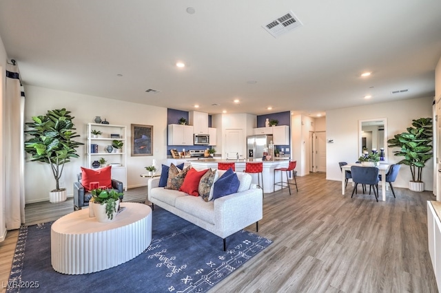 7965 Aurora Sky St Unit 623, North Las Vegas, NV 89084 - living room featuring light wood-style floors and recessed lighting