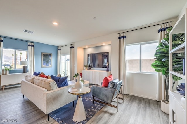 7965 Aurora Sky St Unit 623, North Las Vegas, NV 89084 - living room with plenty of natural light, wood finished floors, and recessed lighting