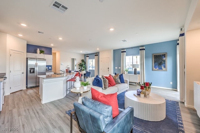 7965 Aurora Sky St Unit 623, North Las Vegas, NV 89084 - living area featuring light wood-style floors and recessed lighting