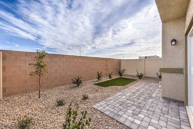 7965 Aurora Sky St Unit 623, North Las Vegas, NV 89084 - fenced backyard with a patio