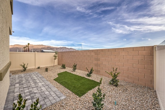7965 Aurora Sky St Unit 623, North Las Vegas, NV 89084 - fenced backyard featuring a patio area and a mountain view