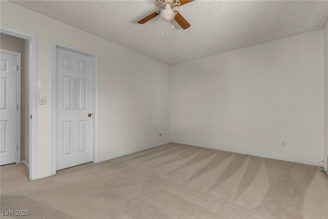 2124 Willowbury Dr Unit D, Las Vegas, NV 89108 - spare room featuring light colored carpet, ceiling fan, and a textured ceiling