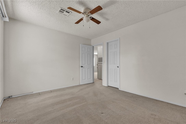 2124 Willowbury Dr Unit D, Las Vegas, NV 89108 - unfurnished bedroom with light carpet, a textured ceiling, and a ceiling fan