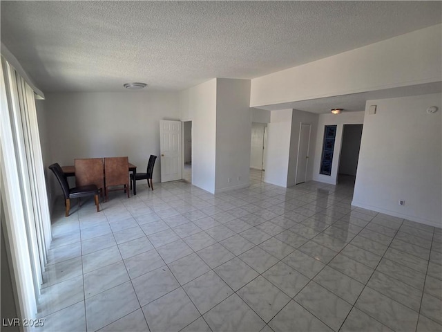 6402 Agua Dr, Las Vegas, NV 89103 - living room featuring a textured ceiling and light tile patterned floors