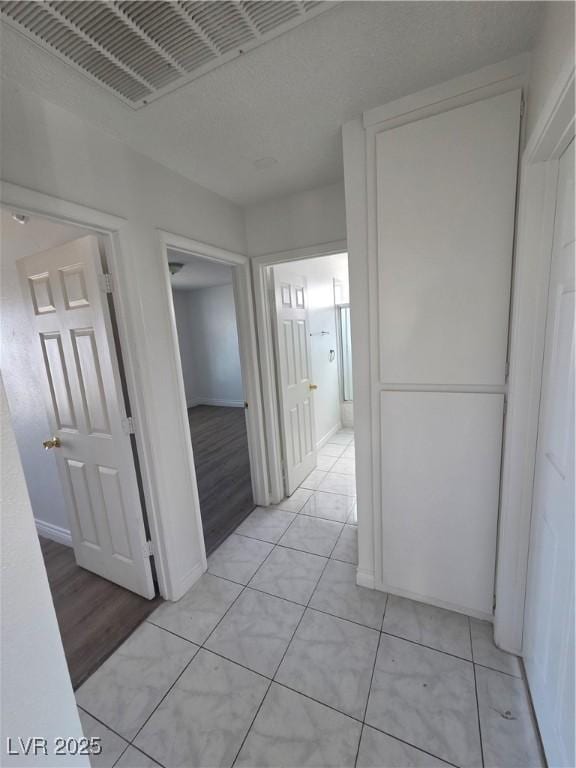 6402 Agua Dr, Las Vegas, NV 89103 - hallway featuring light tile patterned floors