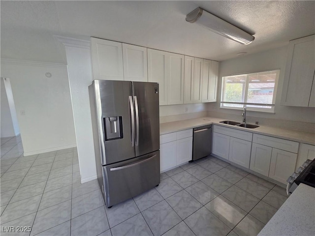 6402 Agua Dr, Las Vegas, NV 89103 - kitchen featuring stainless steel appliances, light countertops, light tile patterned floors, white cabinets, and a textured ceiling