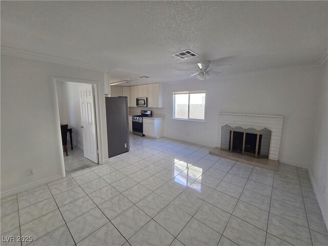 6402 Agua Dr, Las Vegas, NV 89103 - unfurnished living room with ornamental molding, ceiling fan, light tile patterned floors, a brick fireplace, and a textured ceiling