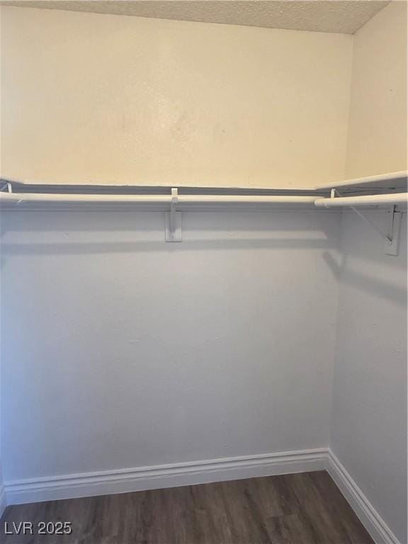 6402 Agua Dr, Las Vegas, NV 89103 - walk in closet featuring dark wood-type flooring