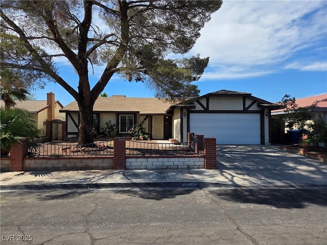 6402 Agua Dr, Las Vegas, NV 89103 - view of front of house featuring stucco siding, an attached garage, and concrete driveway
