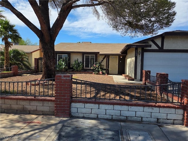 6402 Agua Dr, Las Vegas, NV 89103 - single story home featuring stucco siding, a fenced front yard, and a garage