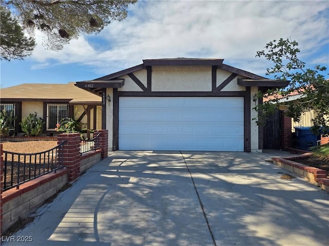 6402 Agua Dr, Las Vegas, NV 89103 - ranch-style home featuring stucco siding, concrete driveway, and a garage