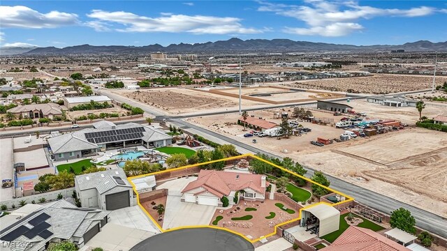9180 Mohawk St, Las Vegas, NV 89139 - aerial overview of property's location with a mountain backdrop and property parcel outlined