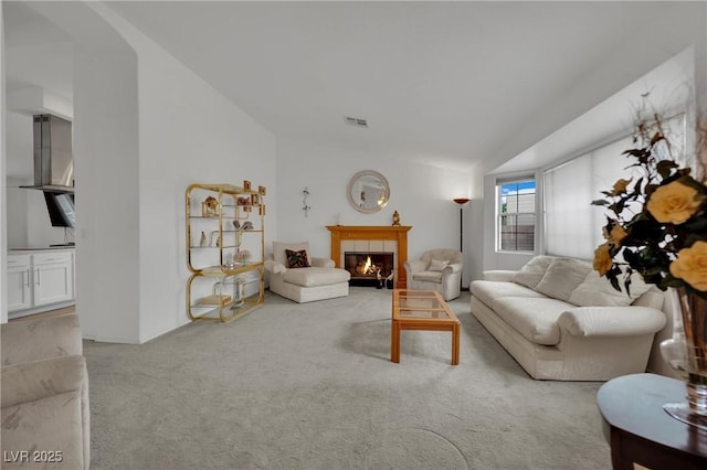 9180 Mohawk St, Las Vegas, NV 89139 - carpeted living room featuring a tiled fireplace