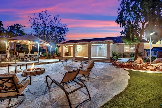 9180 Mohawk St, Las Vegas, NV 89139 - view of patio with an outdoor fire pit and a gazebo