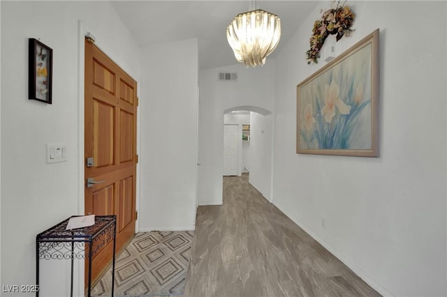 9180 Mohawk St, Las Vegas, NV 89139 - corridor featuring arched walkways and a chandelier
