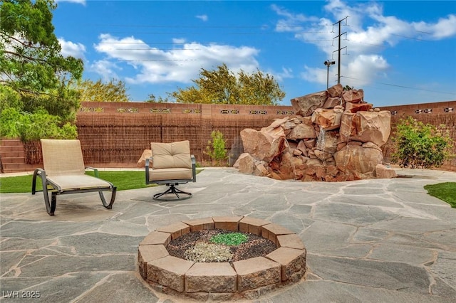 9180 Mohawk St, Las Vegas, NV 89139 - view of patio / terrace with a fire pit