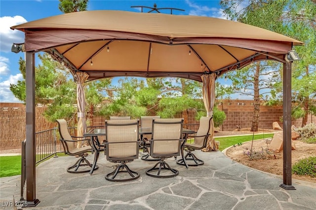 9180 Mohawk St, Las Vegas, NV 89139 - view of patio / terrace with a gazebo and outdoor dining space