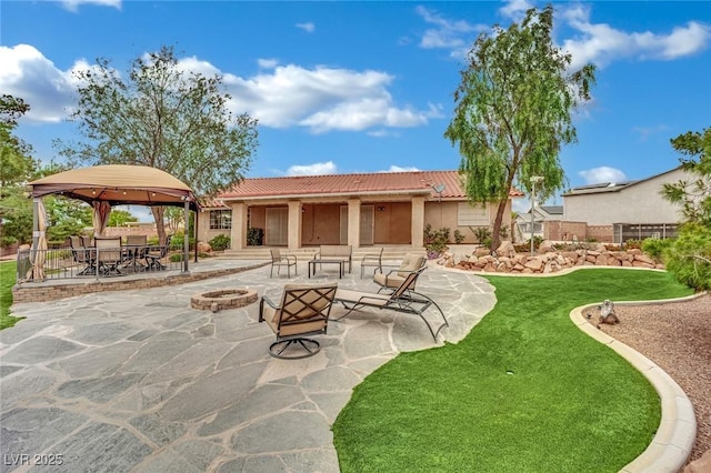 9180 Mohawk St, Las Vegas, NV 89139 - view of patio / terrace with a gazebo, an outdoor fire pit, and outdoor dining space