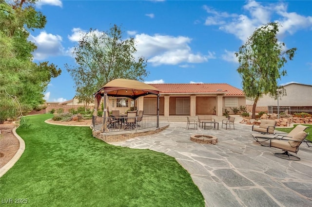 9180 Mohawk St, Las Vegas, NV 89139 - view of patio / terrace with an outdoor fire pit and a gazebo