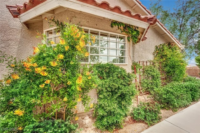 9180 Mohawk St, Las Vegas, NV 89139 - view of side of home featuring stucco siding