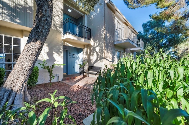 882 Tam O Shanter, Las Vegas, NV 89109 - property entrance with a balcony and brick siding
