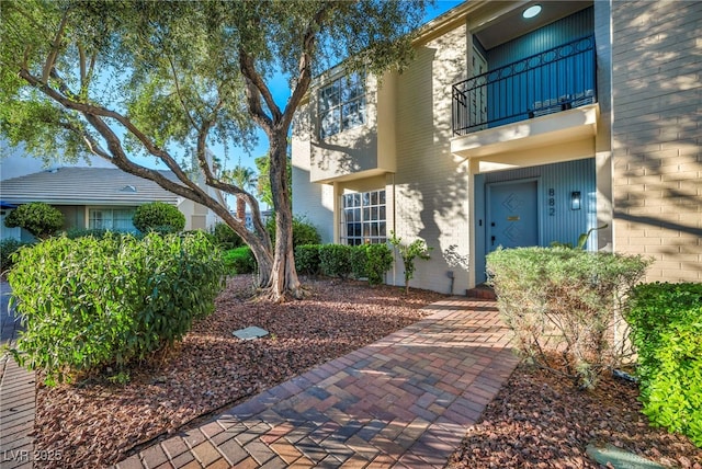882 Tam O Shanter, Las Vegas, NV 89109 - property entrance featuring a balcony and brick siding