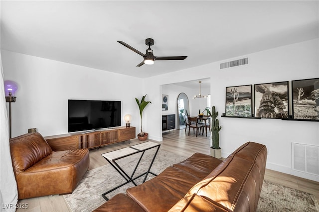 882 Tam O Shanter, Las Vegas, NV 89109 - living area featuring wood finished floors, ceiling fan, and arched walkways