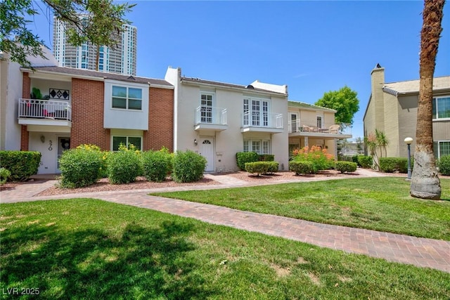 572 Tam O Shanter, Las Vegas, NV 89109 - multi unit property featuring a front yard and a balcony