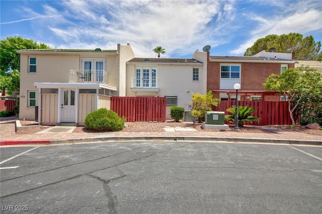 572 Tam O Shanter, Las Vegas, NV 89109 - townhome / multi-family property featuring a balcony, uncovered parking, and stucco siding